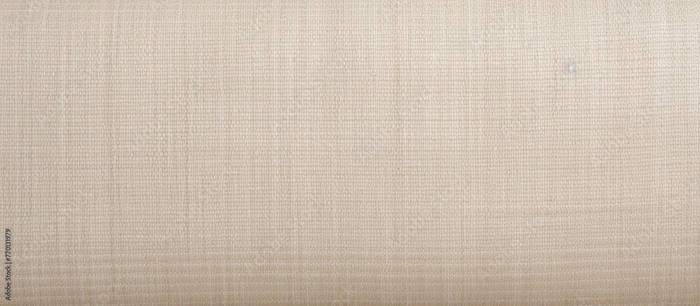Fototapeta premium A close up of a brown rectangle of striped pattern on beige fabric, resembling wood flooring. The tints and shades of peach create a symmetrical design