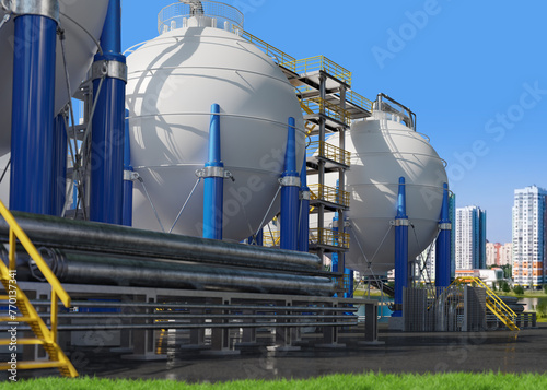 Industrial Gas Storage Tanks and Pipes in a Facility with Urban Skyline in the Background
