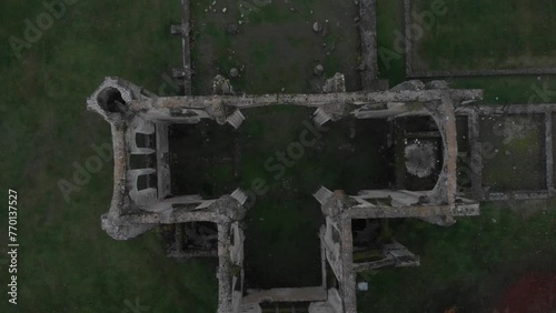 Ruins of Abbaye Notre-Dame du Lys in France on a gray autumn day and colorful autumn leaves