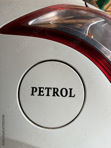 Petrol written on the petrol tank of a whit color swift car © Nk Clicks 