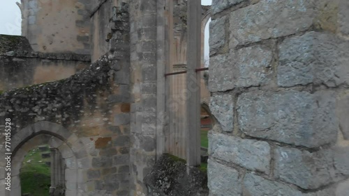 Ruins of medieval Abbaye Notre-Dame du Lys in France on a gray autumn day and colorful autumn leaves