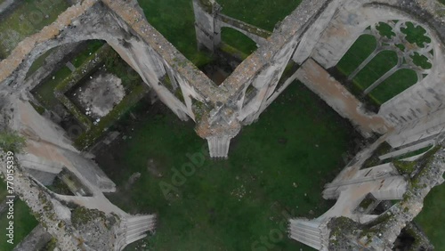 Ruins of medieval Abbaye Notre-Dame du Lys in France on a gray autumn day and colorful autumn leaves photo