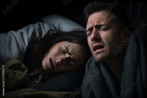 A man and a woman experiencing a terrifying nightmare while sleeping in bed at night. The eerie atmosphere intensifies the fear as haunting images haunt their dreams.
