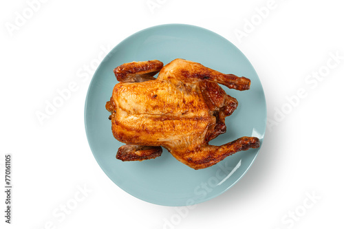 Roasted chicken on a plate on white background. Top view