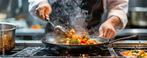A chef is cooking food in a pan with steam coming out of it