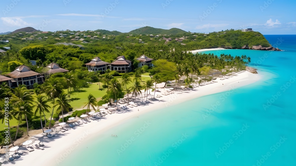 Aerial view of tropical beach with white sand, turquoise water and palm trees. Luxury villas on paradise island.