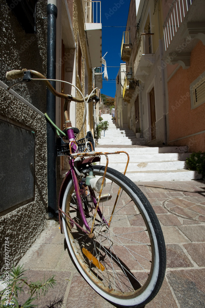 bicycle in the street, Carloforte, il borgo. Isola di San Pietro. CI, Sardegna, Italy bicycle in the street, Carloforte, il borgo. Isola di San Pietro. CI, Sardegna, Italy