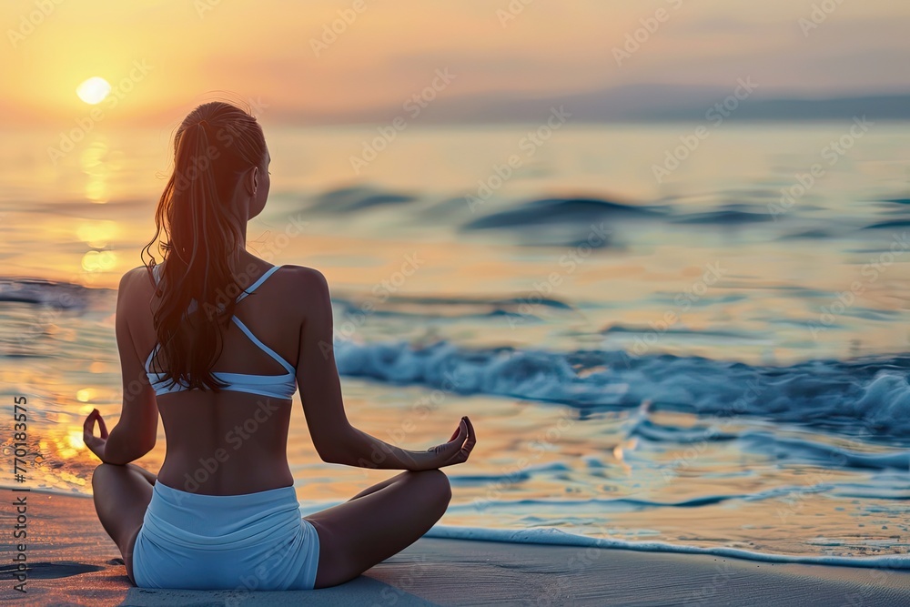 A serene beach scene with a person in a meditative yoga pose