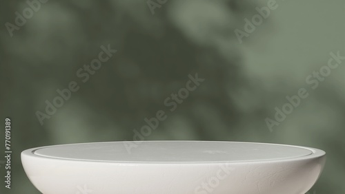 Empty white round stone table podium in dappled sunlight, leaf foliage shadow on green concrete wall for luxury organic cosmetic, skincare, body care, beauty product display background 3D