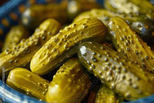Close-up of pickled cucumbers with glistening drops.
