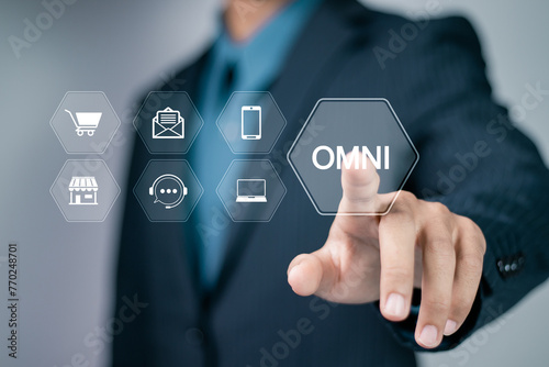 Omni Channel marketing concept. Digital online marketing. Businessman touching omni channel icons on virtual screen for business and social media marketing. photo