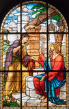 MILAN, ITALY - MARCH 6, 2024: The Jesus and the Samaritan woman in the stained glass of the church Chiesa del Redentore by unknown artist (1933).