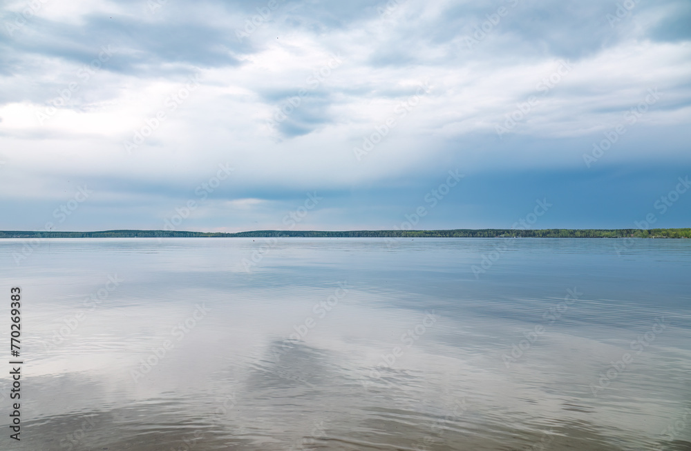Blue lake with cloudy sky, natural background
