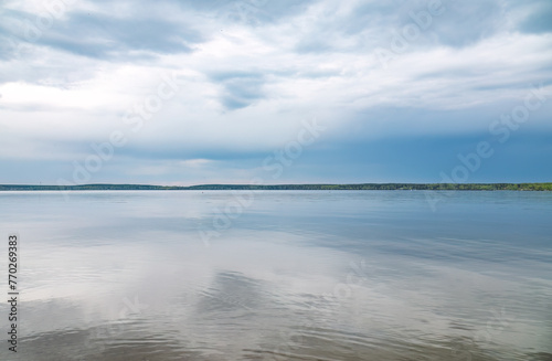Blue lake with cloudy sky  natural background