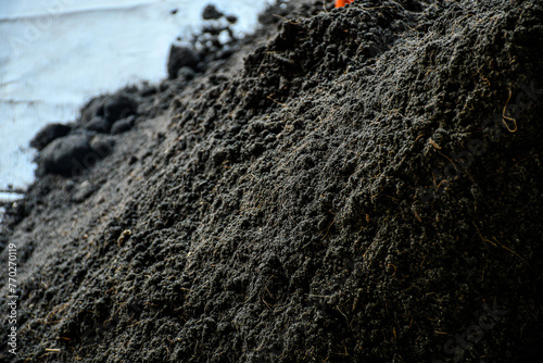 A pile of compost mixture for planting, black compost soil for planting