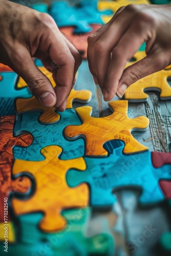 Hands Working on Colorful Jigsaw Puzzle.