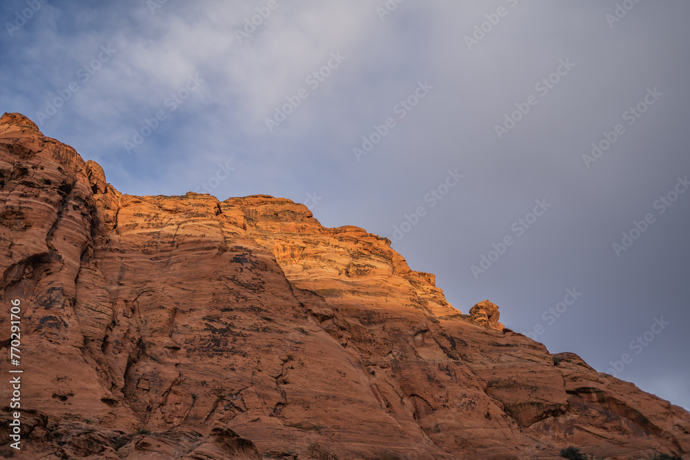 Sun Shining on Red Rocks Hazy Sky