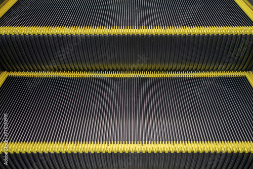 Escalator floor with copy space. Close up of the metal steps of a typical escalator. Staircase, Steps, Three Objects, Single Step, Motion
