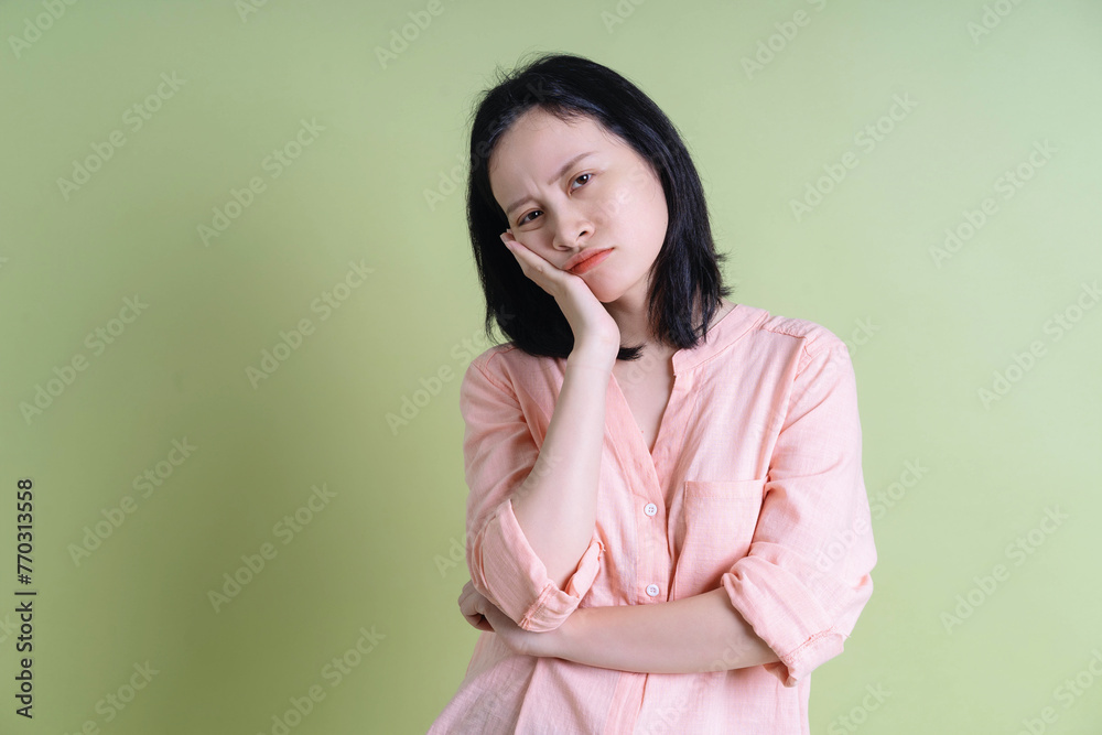 Photo of young Asian woman on background Photo of young Asian woman on background