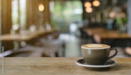 Warm Café Welcome: Blurred Café Interior with Focused Wooden Table