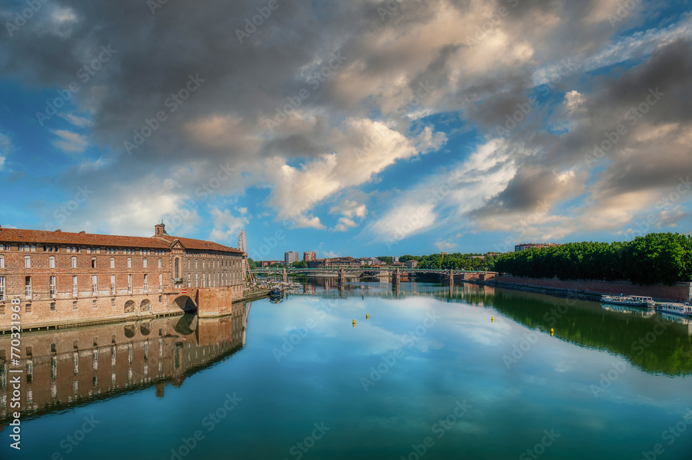 Naklejka premium Toulouse is the capital of the Occitania region in southern France. It is divided by the Garonne River and is located near the border with Spain. It is known as La Ville Rose