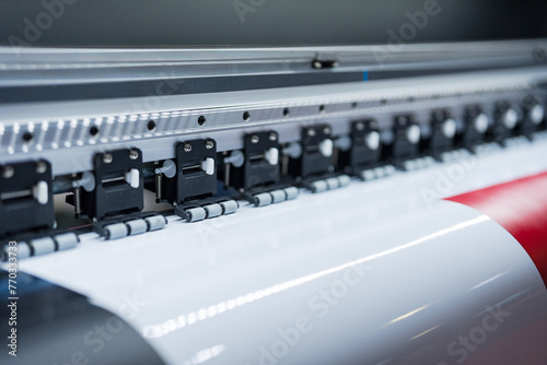 Close-up of large format printer heads in action