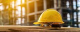 focus of yellow helmet lying on the background of building construction or building architectural project