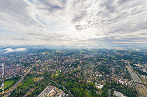 Ghent, Belgium. Industrial area. Panorama of the city. Summer day, cloudy weather. Aerial view © nikitamaykov