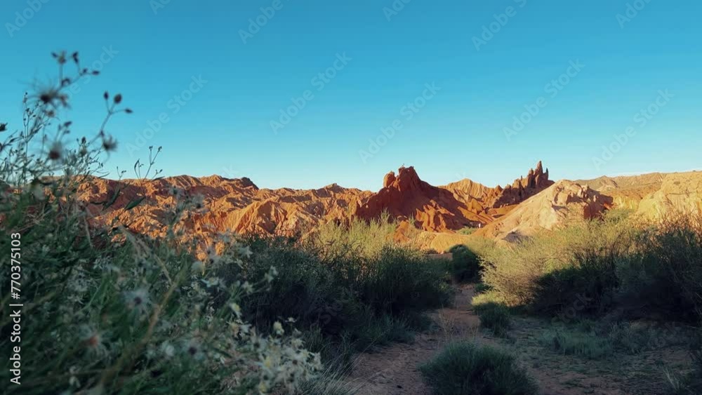 A fabulous canyon in Central Asia. Scenic view of a beautiful textured multi-layered canyon. Mountain ranges in a fabulous canyon at sunset near Lake Issyk-Kul in Karakol. 4K A fabulous canyon in Central Asia. Scenic view of a beautiful textured multi-layered canyon. Mountain ranges in a fabulous canyon at sunset near Lake Issyk-Kul in Karakol. 4K