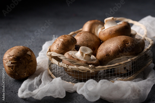 King mushrooms in a basket on a gray background photo