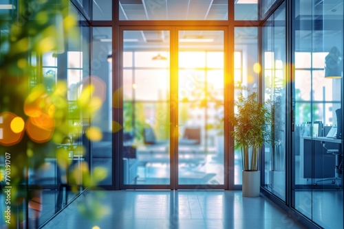 Blurred background of a modern office interior with panoramic windows and a glass door. An abstract blurry backdrop for design, concept business or travel. 