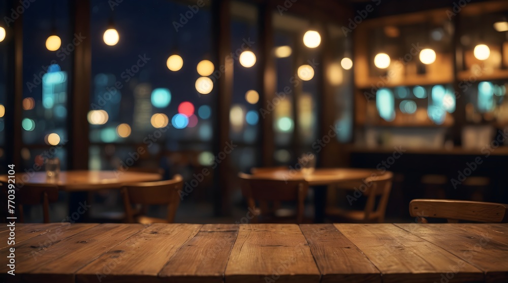 empty wooden table with blurred bokeh background of night cafe