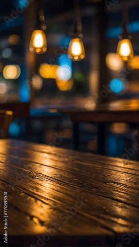 empty wooden table with blurred bokeh background of night cafe © Amir Bajric