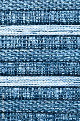 Striped blue textured background. Texture of wool fabric. 