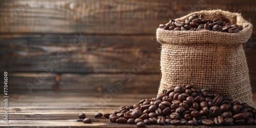 jute bag with coffee beans on wooden background concept banner