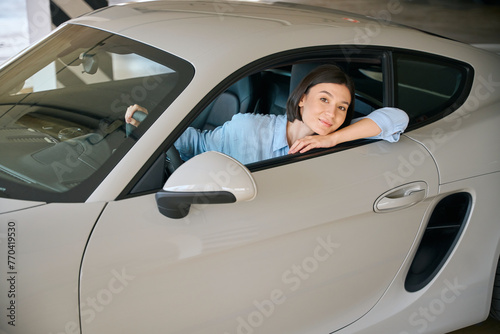 Business lady, driving new automobile at parking