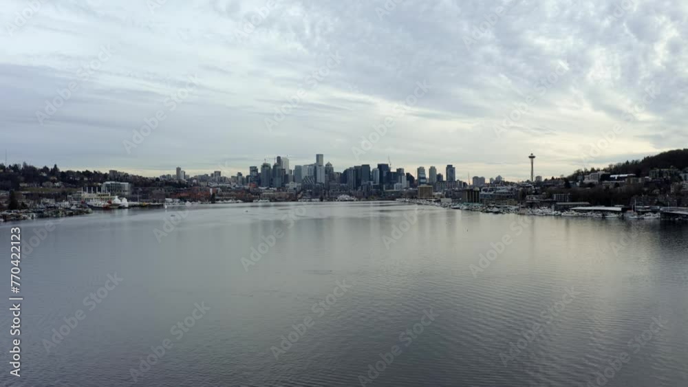 Aerial drone shot of the Seattle city skyline with skyscrapers, the space needle and Lake Union from the famous tourist destination, Gas Works Park on overcast spring evening Aerial drone shot of the Seattle city skyline with skyscrapers, the space needle and Lake Union from the famous tourist destination, Gas Works Park on overcast spring evening