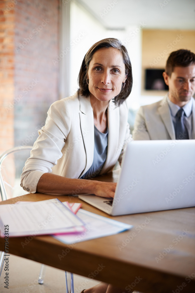 Senior woman, portrait or business people in meeting with laptop, notes or confidence in boardroom. Teamwork, mature manager or confident employee planning strategy, feedback report or group project Senior woman, portrait or business people in meeting with laptop, notes or confidence in boardroom. Teamwork, mature manager or confident employee planning strategy, feedback report or group project