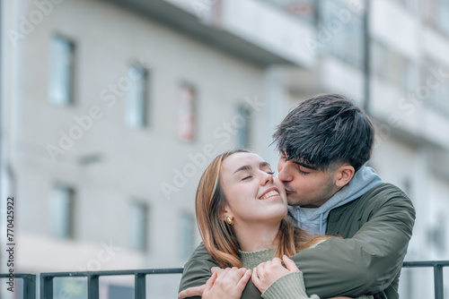 wedding couple hugging on the street