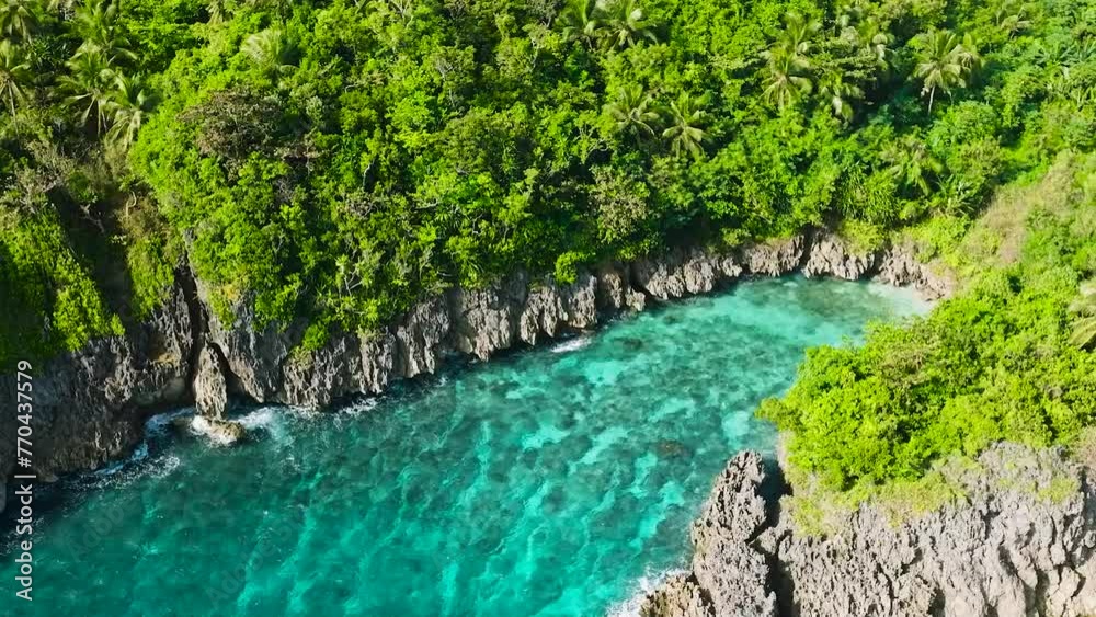 Waves crashing on rocky coastal with turquoise sea water and corals. San Jose Island. Romblon, Philippines. Waves crashing on rocky coastal with turquoise sea water and corals. San Jose Island. Romblon, Philippines.