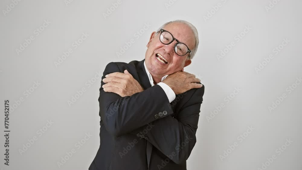 Cheerful senior man in business clothes, hugging self in pure joy and confidence. smiling, radiating positivity, embodying self-love against a pristine white, isolated background. Cheerful senior man in business clothes, hugging self in pure joy and confidence. smiling, radiating positivity, embodying self-love against a pristine white, isolated background.