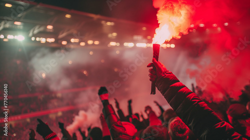 close up of a football supporter's hand holding a red smoke flare passionately, stadium stands in the background. Ai generated Images