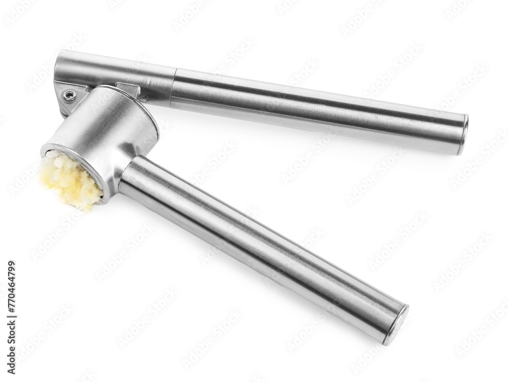One metal press with crushed garlic isolated on white, above view One metal press with crushed garlic isolated on white, above view