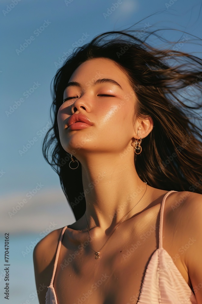 model with hair blowing in the wind, a light pink sleeveless top, with a blue sky background, model with hair blowing in the wind, a light pink sleeveless top, with a blue sky background,