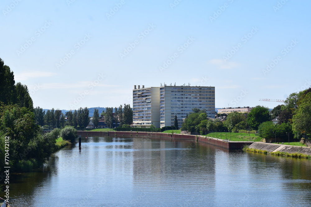 Mosel in Thionville with a tall building