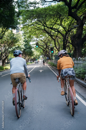 A young couple riding their bicycles in the summer. © Jonathan De Guzman
