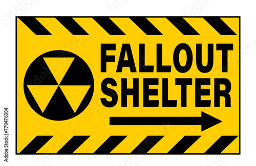 Fallout shelter. Information sign with nuclear symbol, directional arrow and text . Yellow black barricade tape above and below.	