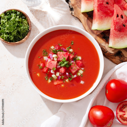 Obraz na plátně Spanish tomato and watermelon gazpacho cold soup styled and decorated in white p