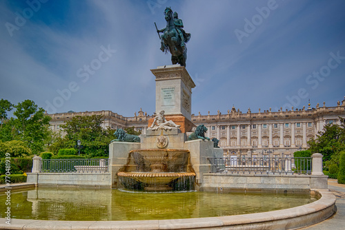 Madrid, Spain - July 22, 2023: Para Gloria de las Artes as Equestrian Statue of Philip IV in Front of Real Palacio photo