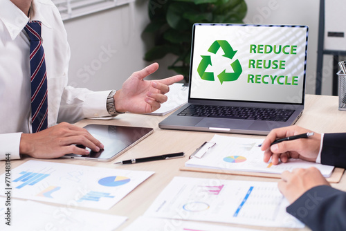 Green business company with eco-friendly waste management regulation concept. Businessman use a computer to analyze and planning waste recycling for corporation. Recycle reduce reuse policy.